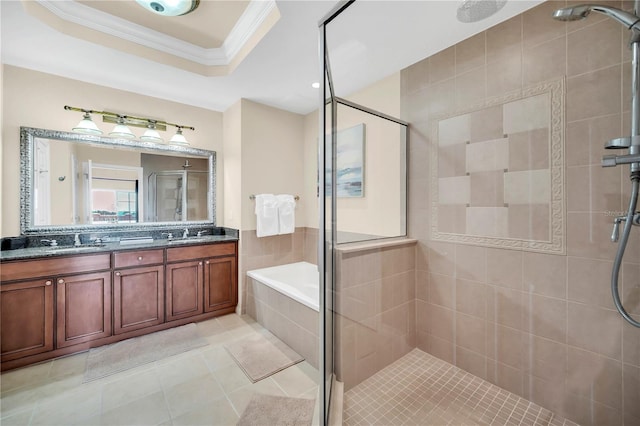 bathroom with shower with separate bathtub, double vanity, a raised ceiling, ornamental molding, and tile flooring