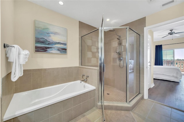 bathroom with tile flooring, plus walk in shower, and ceiling fan