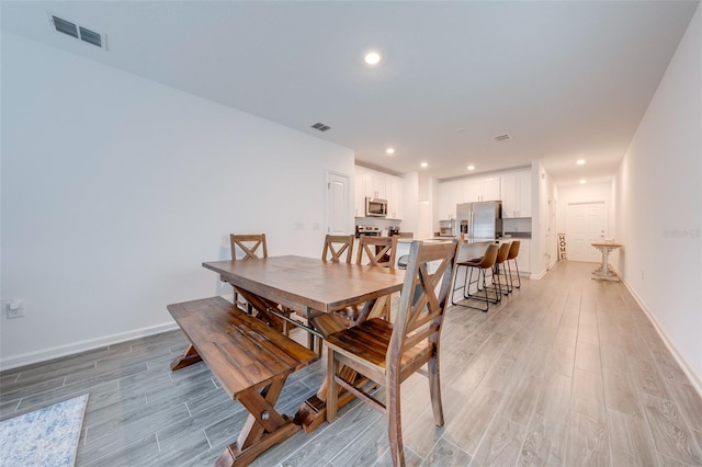 dining room featuring light wood-type flooring