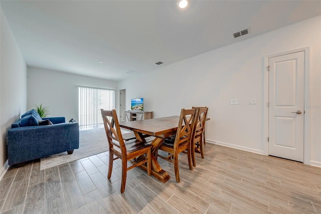 dining room featuring light hardwood / wood-style flooring