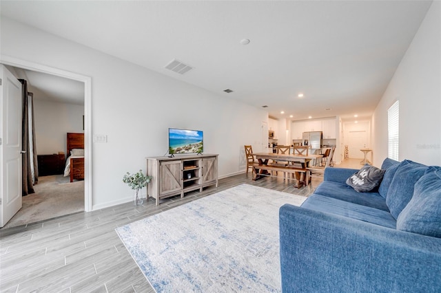 living room featuring light colored carpet