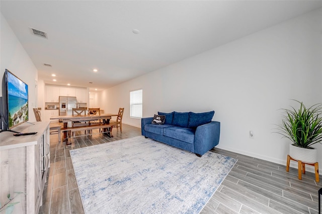 living room with light hardwood / wood-style floors