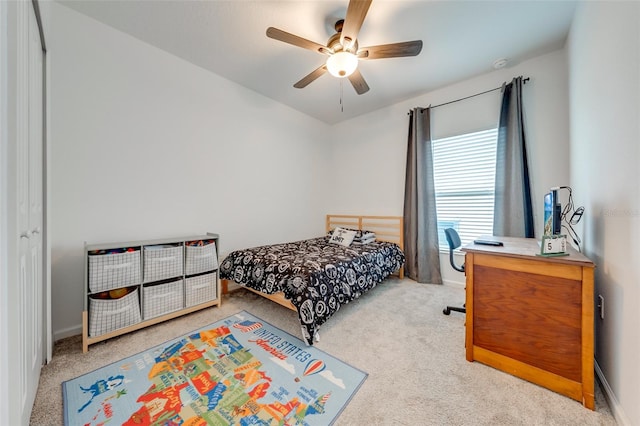 bedroom with light colored carpet and ceiling fan