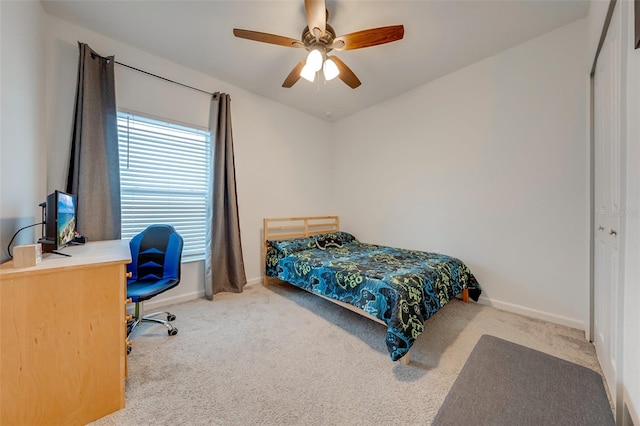 bedroom with light carpet, a closet, and ceiling fan