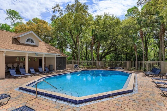 view of swimming pool featuring a patio area