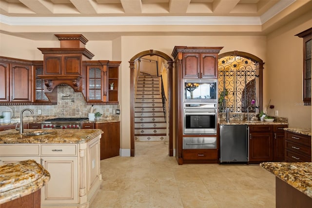 kitchen with light tile flooring, fridge, backsplash, oven, and sink