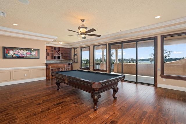 rec room featuring ceiling fan, ornamental molding, dark wood-type flooring, pool table, and a textured ceiling