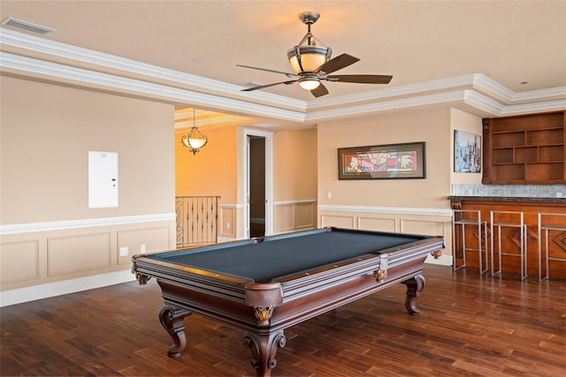 rec room with ceiling fan, a raised ceiling, crown molding, dark hardwood / wood-style flooring, and pool table