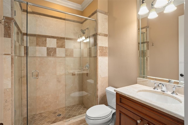 bathroom featuring toilet, a shower with door, ornamental molding, and oversized vanity