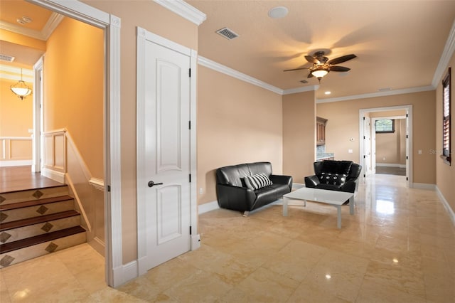 living area featuring ornamental molding, ceiling fan, and light tile floors