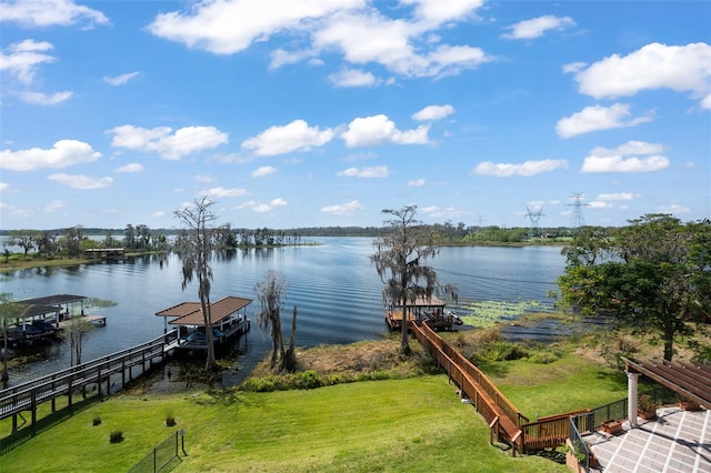 exterior space featuring a water view and a yard