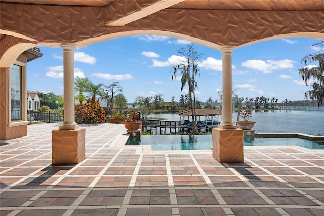 view of terrace with a water view