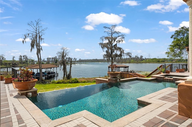 view of swimming pool featuring a gazebo, pool water feature, and a water view