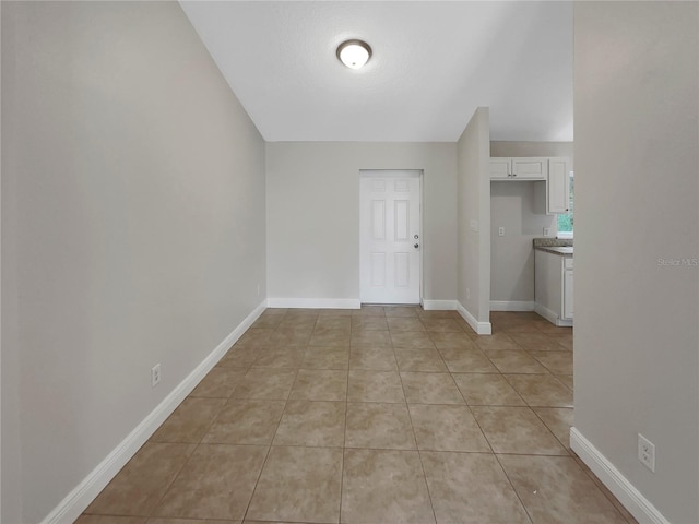 interior space featuring light tile floors