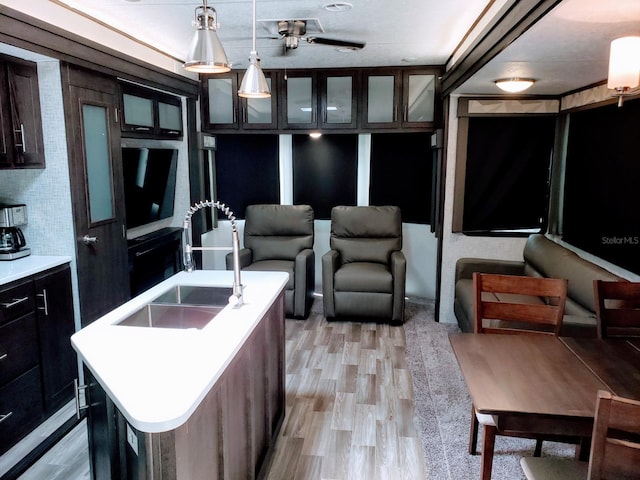 interior space with ceiling fan and light wood-type flooring