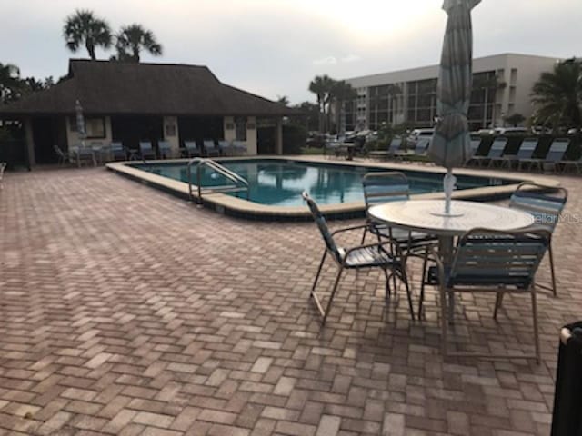 view of swimming pool featuring a patio area