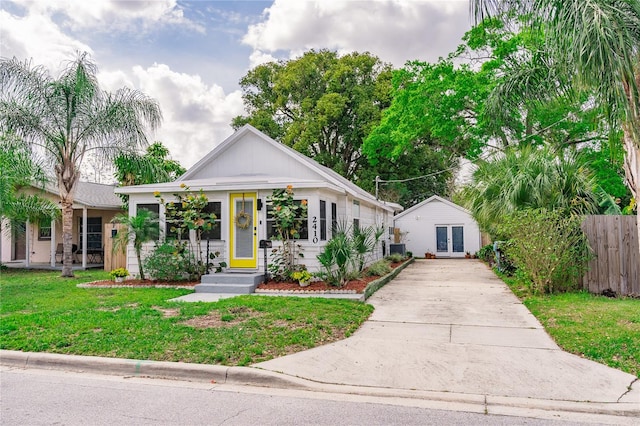 bungalow-style home with a front yard