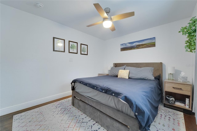 bedroom with light hardwood / wood-style floors and ceiling fan