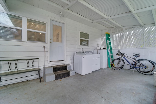 property entrance with washer and clothes dryer and a patio