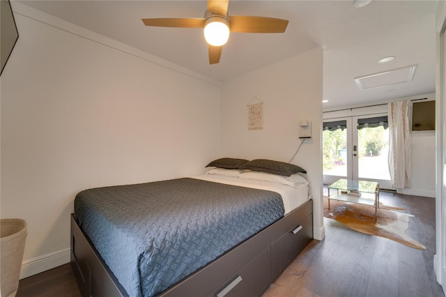 bedroom featuring french doors, dark hardwood / wood-style flooring, and ceiling fan