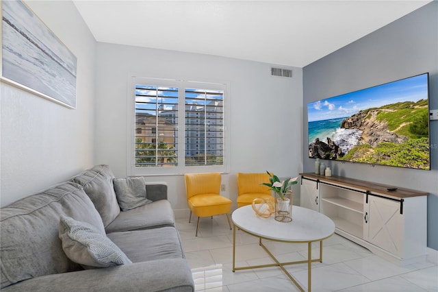 living room featuring light tile flooring