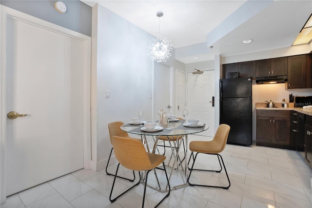 tiled dining room featuring a notable chandelier