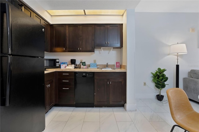 kitchen featuring dark brown cabinets, sink, light tile floors, and black appliances