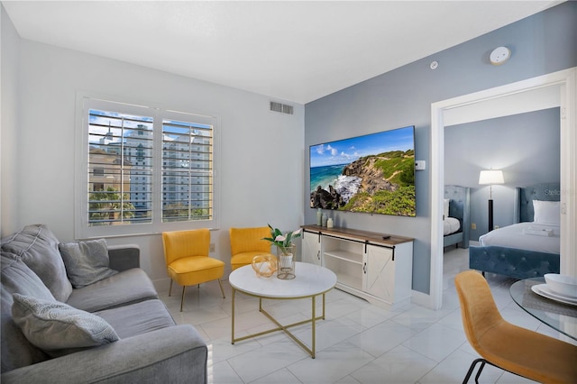 living room featuring light tile floors