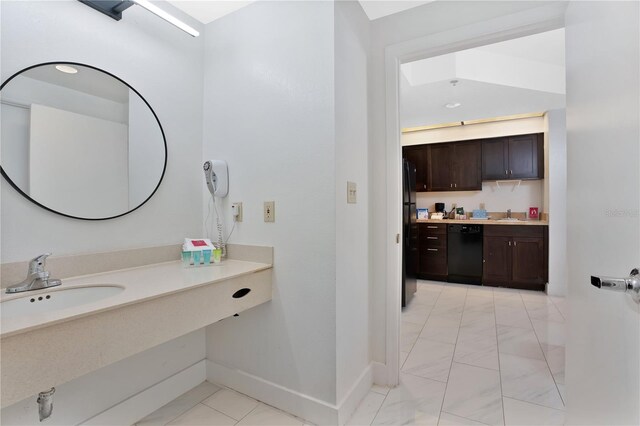 bathroom with vanity and tile flooring