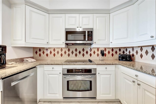 kitchen featuring appliances with stainless steel finishes, light stone countertops, and white cabinets