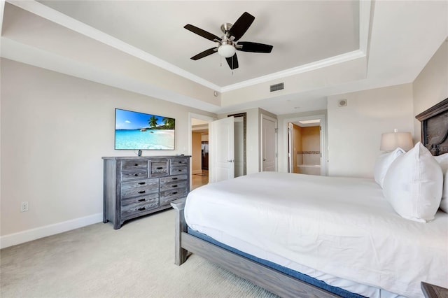 bedroom featuring baseboards, ceiling fan, visible vents, a raised ceiling, and light carpet