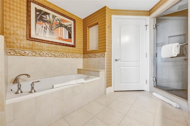 full bath with a garden tub, wallpapered walls, and tile patterned floors