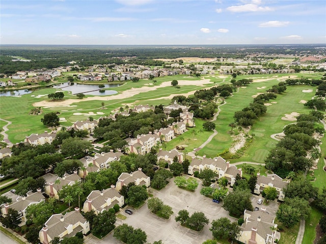 aerial view featuring view of golf course, a water view, and a residential view