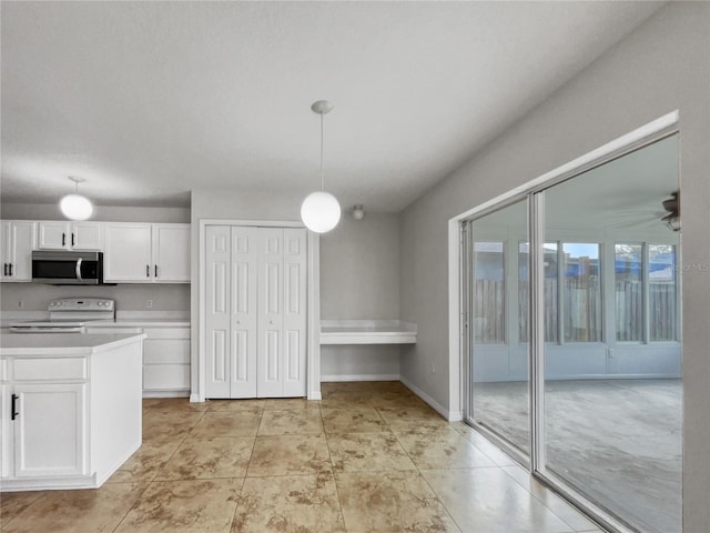 kitchen with ceiling fan, hanging light fixtures, white cabinets, and white electric range