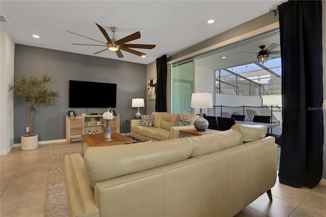 living room featuring light tile flooring and ceiling fan