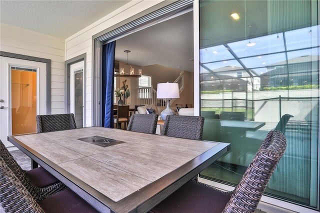 dining space featuring a chandelier