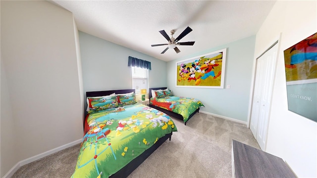 bedroom with carpet flooring, ceiling fan, and a closet