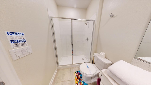 bathroom featuring walk in shower, vanity, toilet, and tile flooring