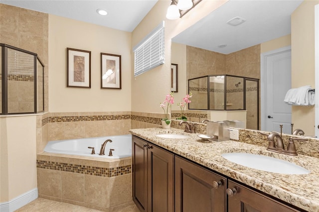 bathroom featuring double sink vanity, tile flooring, and plus walk in shower