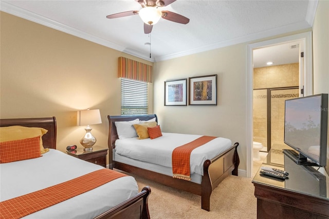 bedroom with crown molding, ceiling fan, ensuite bathroom, and light colored carpet