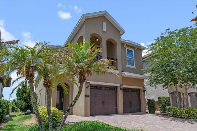 mediterranean / spanish-style home with a garage