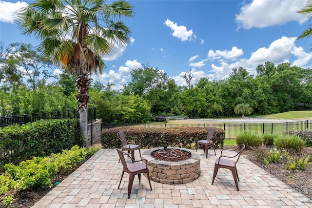 view of patio with an outdoor fire pit