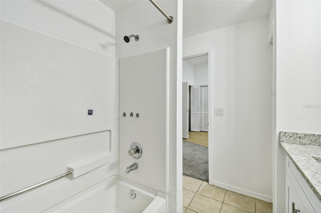 bathroom with tile patterned flooring, vanity, shower / bath combination, and a textured ceiling