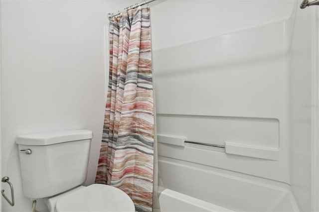 bathroom featuring toilet and shower / tub combo with curtain