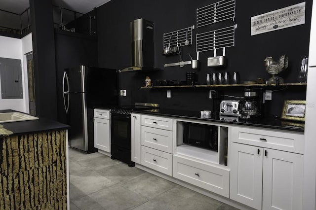 kitchen with black / electric stove, light tile patterned flooring, white cabinetry, electric panel, and wall chimney exhaust hood