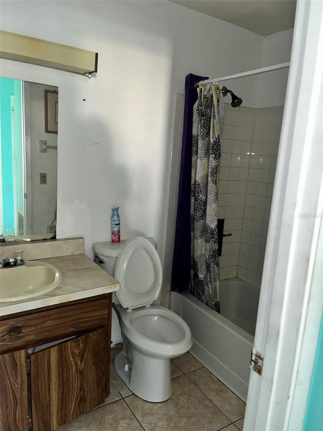 full bathroom with toilet, shower / tub combo, tile floors, and vanity