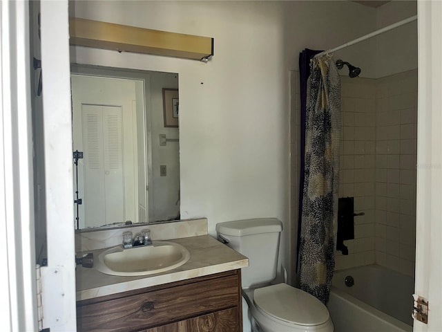 bathroom with toilet, shower / bath combo with shower curtain, and vanity