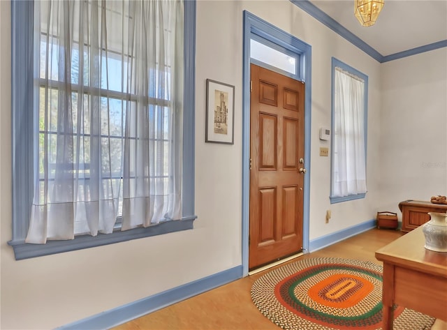 foyer featuring crown molding