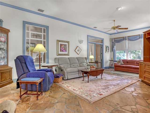 living room featuring crown molding, ceiling fan, and light tile flooring