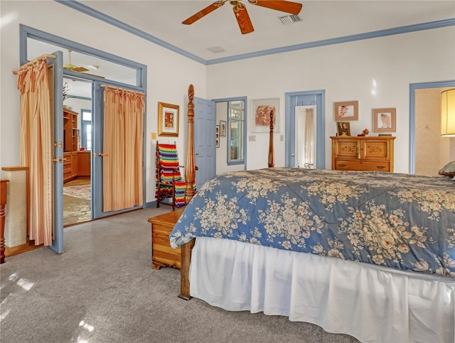 carpeted bedroom with connected bathroom, ceiling fan, and crown molding